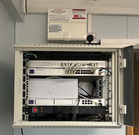 Professional network rack with UniFi equipment installation